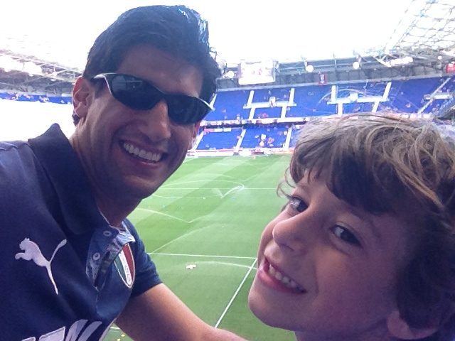 Two soccer fans enjoying a great game.