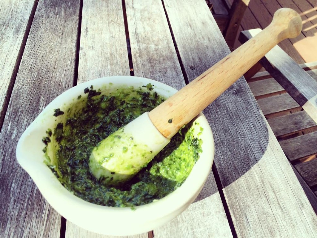 Making pesto the old fashioned way - mortar and pestle.