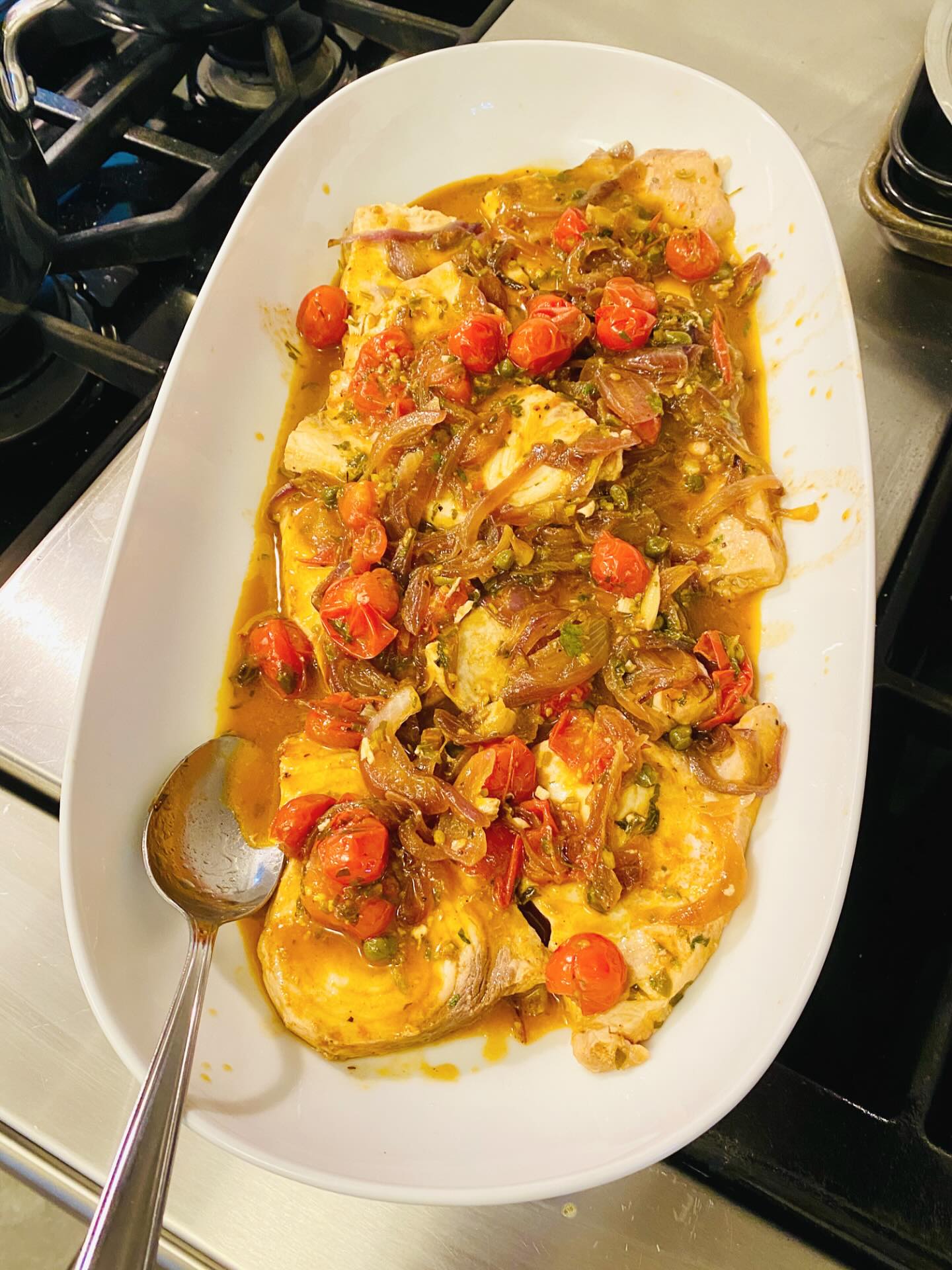 Pesce spada alla ghiotta - olives, anchovies, capers, raisins, pine nuts, and cherry tomatoes.