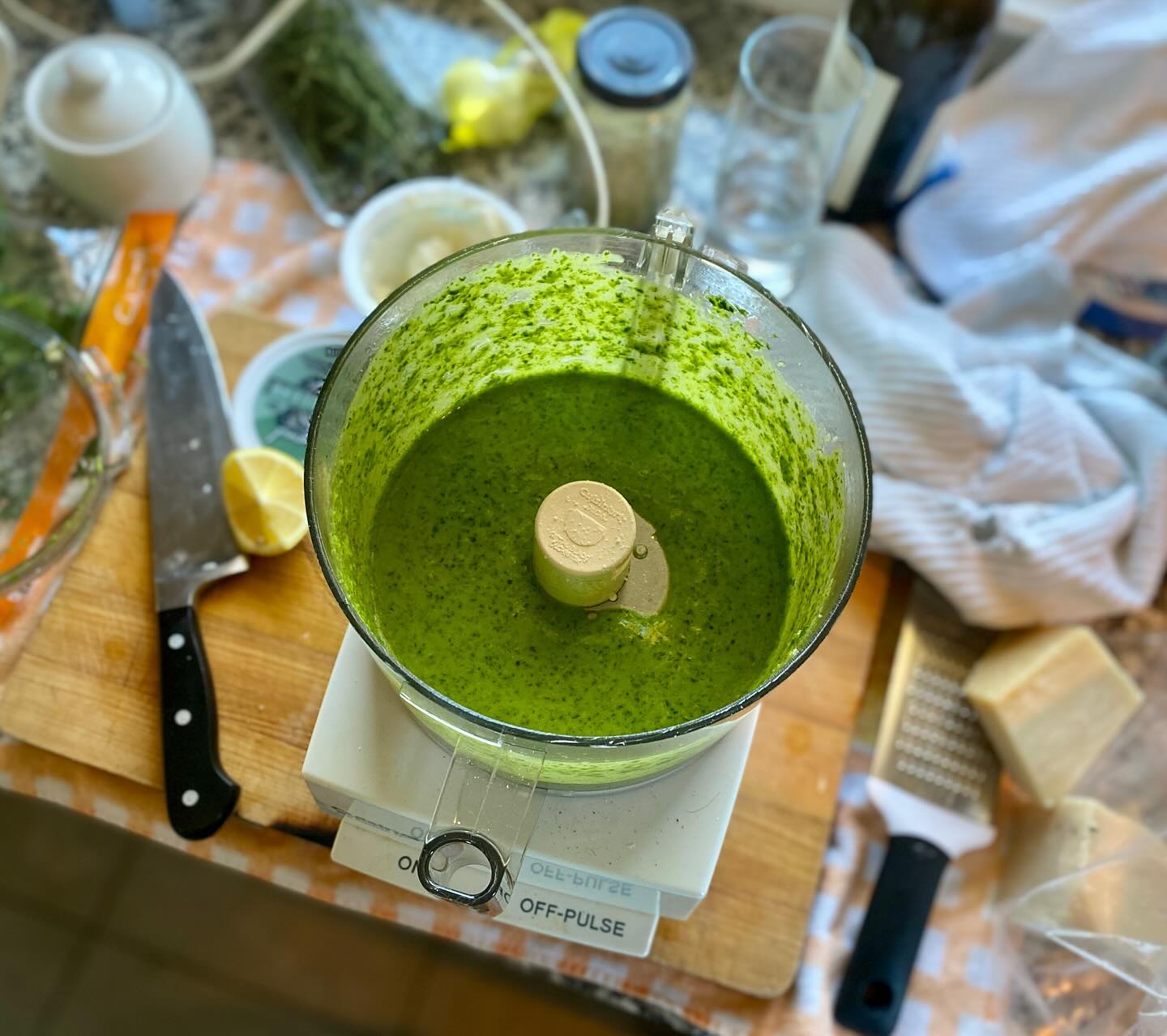 Pesto sauce preparation (I wish I could say I use a mortar and pestle but the modern <cooking> world has spoiled me). Recipe at: http://www.scordo.com/food/how-to-make-pesto-basil-genoa-authentic.html